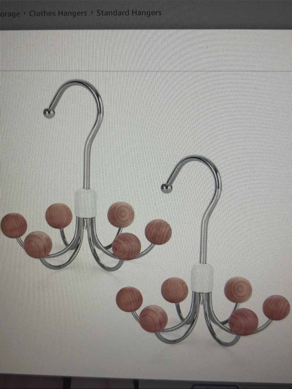 Chrome multi-hook hanger with round cedar wooden knob ends.